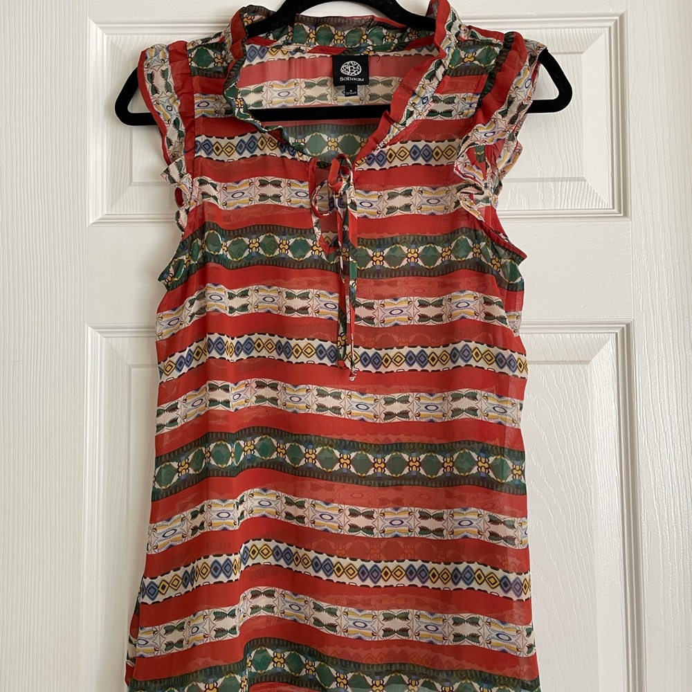 Bobeau sleeveless top with tie at neck and ruffled trim
